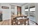 Bright dining area with sliding doors leading to deck and views at 1210 Horsetail Loop, Elizabeth, CO 80107