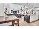 Modern kitchen with granite island, white cabinetry, and stainless steel appliances at 1210 Horsetail Loop, Elizabeth, CO 80107