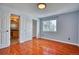 Spacious bedroom with hardwood floors and an ensuite bathroom at 2320 Flagstaff Dr, Longmont, CO 80504