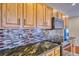 This kitchen is equipped with stainless steel appliances and gorgeous stone countertops at 2320 Flagstaff Dr, Longmont, CO 80504