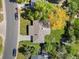 Aerial view of a well-maintained home with a mature trees and manicured lawn at 3560 S Glencoe St, Denver, CO 80237