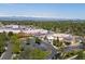 An aerial view of a neighborhood building showcasing the parking lot and tree lined streets in the area at 3560 S Glencoe St, Denver, CO 80237
