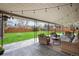 Inviting backyard with covered patio, stylish outdoor furniture, and a swing set for leisure and entertainment at 3560 S Glencoe St, Denver, CO 80237