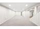 Large basement showcasing neutral carpet, recessed lighting, and access to other areas at 3560 S Glencoe St, Denver, CO 80237