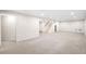 Spacious basement featuring neutral carpet, recessed lighting, and staircase at 3560 S Glencoe St, Denver, CO 80237