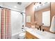 Stylish bathroom with modern fixtures, a shower/tub combo, and updated sink at 3560 S Glencoe St, Denver, CO 80237