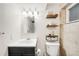 Updated bathroom features modern vanity, elegant fixtures, and tiled shower at 3560 S Glencoe St, Denver, CO 80237