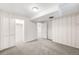 Bedroom featuring neutral carpet, built-in closet and access to other rooms at 3560 S Glencoe St, Denver, CO 80237