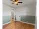 Bedroom with hardwood floors, closet, ceiling fan, and accent paint on the walls at 3560 S Glencoe St, Denver, CO 80237