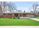 Charming brick ranch home with a well-manicured lawn and inviting curb appeal at 3560 S Glencoe St, Denver, CO 80237