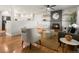 Cozy living room featuring hardwood floors, a brick fireplace, and stylish furniture at 3560 S Glencoe St, Denver, CO 80237