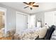 Bright main bedroom featuring a walk-in closet, hardwood floors, and ensuite bathroom at 3560 S Glencoe St, Denver, CO 80237