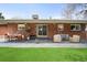 Relaxing outdoor patio features stylish seating, dining, and a well-maintained lawn for outdoor enjoyment at 3560 S Glencoe St, Denver, CO 80237