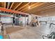 Unfinished basement features an open ceiling and concrete flooring at 6230 Snowberry Ave, Firestone, CO 80504