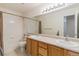 Bathroom featuring a tub/shower combination and a double sink vanity at 6230 Snowberry Ave, Firestone, CO 80504