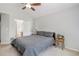 Cozy bedroom with neutral tones, a ceiling fan, and natural light at 6230 Snowberry Ave, Firestone, CO 80504