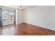 Bedroom features wood flooring and a large window at 6230 Snowberry Ave, Firestone, CO 80504