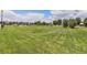 Lush green park featuring a walking path, a stream, and plenty of space for outdoor activities and relaxation at 6230 Snowberry Ave, Firestone, CO 80504