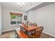 Elegant dining room with wood floors and a wooden dining table at 6230 Snowberry Ave, Firestone, CO 80504