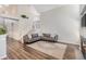 Open living space with wood floors, neutral colors, and staircase to the second floor at 6230 Snowberry Ave, Firestone, CO 80504