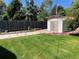 Well-maintained backyard with a shed offering additional storage space and nice landscaping at 1299 S Brentwood Way, Lakewood, CO 80232
