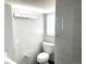 Bathroom featuring modern lighting, stylish tile, and updated fixtures at 1299 S Brentwood Way, Lakewood, CO 80232