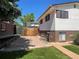 A split level home with a mix of brick and siding, showcasing its unique architecture and curb appeal at 1299 S Brentwood Way, Lakewood, CO 80232