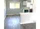 Bright kitchen features modern appliances and updated gray vinyl flooring at 1299 S Brentwood Way, Lakewood, CO 80232