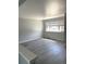 Spacious living room featuring hard surface floors and natural light at 1299 S Brentwood Way, Lakewood, CO 80232