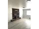 Inviting living room with brick fireplace, hard surface floors and large windows at 1299 S Brentwood Way, Lakewood, CO 80232