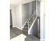 Staircase with hard surface steps and white railing at 1299 S Brentwood Way, Lakewood, CO 80232