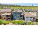 Beautiful backyard showcasing lush greenery, patio, and scenic views of the surrounding community at 18180 W 84Th Pl, Arvada, CO 80007