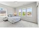 Spacious bedroom featuring large windows providing neighborhood views at 18180 W 84Th Pl, Arvada, CO 80007