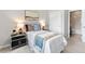 Bright bedroom featuring soft carpet, closet, and ensuite bathroom at 18180 W 84Th Pl, Arvada, CO 80007