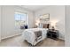 Cozy bedroom with neutral tones, a window seat and coordinated decorative pillows and lamps at 18180 W 84Th Pl, Arvada, CO 80007