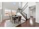 Dining room with large windows and a staircase at 18180 W 84Th Pl, Arvada, CO 80007