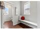 Cozy entryway with built-in bench seating and natural light from the side windows at 18180 W 84Th Pl, Arvada, CO 80007