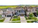 Beautiful two-story home with a blue exterior, well-manicured lawn, and a two-car garage at 18180 W 84Th Pl, Arvada, CO 80007
