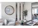 Comfortable home office with unique decorations, a mirror, a plant, and an open view of the living room at 18180 W 84Th Pl, Arvada, CO 80007