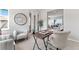 Bright home office featuring a desk and chairs, with natural light filling the inviting workspace at 18180 W 84Th Pl, Arvada, CO 80007