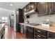 Close up shot of kitchen with gas range, granite countertops, and stainless steel appliances at 18180 W 84Th Pl, Arvada, CO 80007