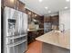 Updated kitchen with stainless steel appliances, granite countertops, and ample cabinet space at 18180 W 84Th Pl, Arvada, CO 80007