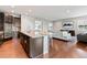 Modern kitchen island view, showcases seating and an open floor plan into the living area at 18180 W 84Th Pl, Arvada, CO 80007
