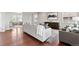 Bright living room boasts hardwood floors, neutral tones, and contemporary decor at 18180 W 84Th Pl, Arvada, CO 80007