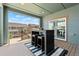 Covered patio with outdoor seating, offering a comfortable space for relaxation and entertaining at 18180 W 84Th Pl, Arvada, CO 80007