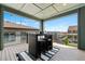 Covered patio with outdoor seating, offering a comfortable space for relaxation and entertaining at 18180 W 84Th Pl, Arvada, CO 80007