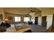 Large, bright main bedroom with vaulted ceiling, ceiling fan, and relaxing sitting area at 14137 Whitney Cir, Broomfield, CO 80023