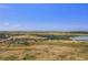 Expansive aerial view of land and Chatfield Reservoir, offering a serene landscape at 13762 E Lehigh Ave # G, Aurora, CO 80014