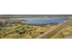 Panoramic aerial view of the lake and adjacent green space with distant skyline at 13762 E Lehigh Ave # G, Aurora, CO 80014