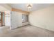 Bright room with a window and carpeted floor at 13762 E Lehigh Ave # G, Aurora, CO 80014